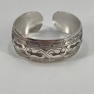 Silver tone floral design cuff bracelet